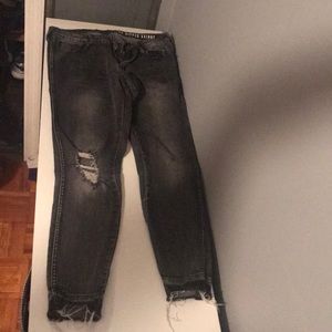 Distressed grey jeans